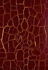 Obraz premium Golden Buddha Silhouette on Cracked Red Surface