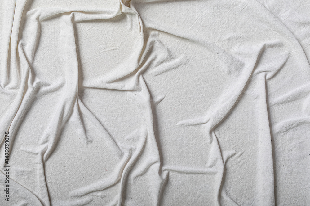 Poster high-resolution image of a cream-colored fabric with wrinkles and texture. perfect for backgrounds a