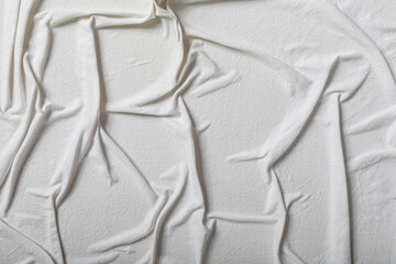 High-resolution image of a cream-colored fabric with wrinkles and texture. Perfect for backgrounds...