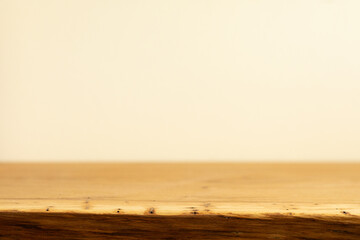 Clean, minimalist image of a light brown wooden surface against a soft beige backdrop. Ideal for...