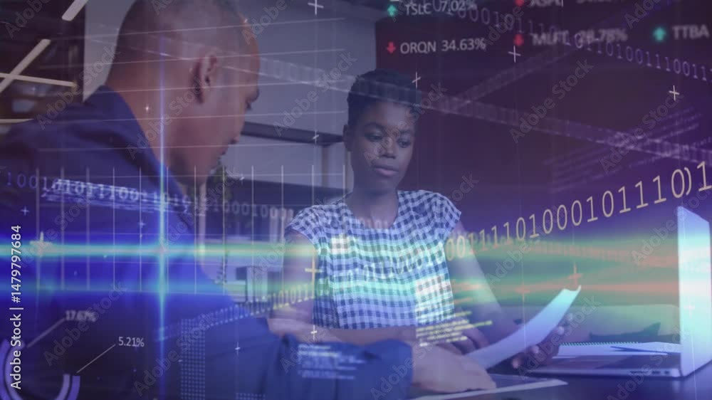 Poster man leaning reviewing financial charts on laptop while woman scanning reports with binary code