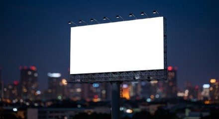 Fototapeta premium Blank billboard against city skyline at dusk ready for advertisement display