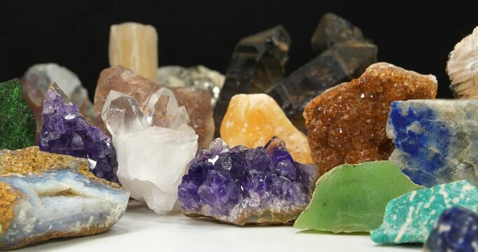 Natural Semi Precious stones and minerals, riches of Earth. Green garnet, purple Amethyst, Gypsum, Quartz crystals, green Nephrite, Lazurite, yellow Calcite and Citrine, Barite, Amazon stone, Pyrite