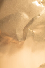 Abstract gold foil background with crumpled texture. Perfect for luxury, elegant designs.