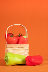 Fresh Vegetables Are Displayed In A Woven Basket, Ripe Tomatoes And Peppers Create Vibrant Produce