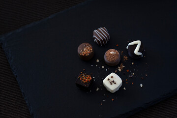 Chocolate assortment on a black tray