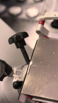 Cyclic motion of a cryostat microtome cutting frozen tissue for rapid intraoperative histology. Preparation of ultrathin sections for microscopic examination.
