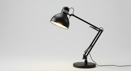 Modern black adjustable desk lamp illuminating a white backdrop elegantly