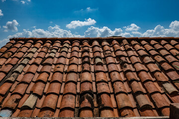 orange brick roof under blue sky