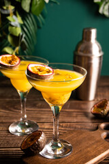 Fresh passion fruit maracuja alcoholic cocktail with ice cubes
