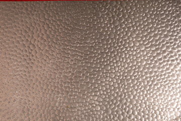 High-resolution image of a hammered metal sheet with a pebble texture. Ideal for backgrounds and...