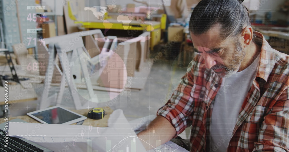 Poster image of world map and data processing over caucasian male carpenter working in workshop