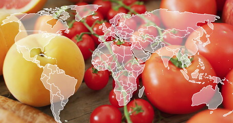Image of world map over fruits and vegetables