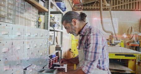 Image of caucasian male carpenter working in workshop