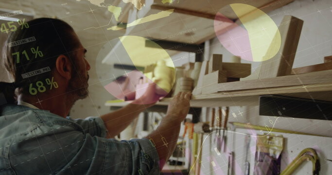 Image of data processing over caucasian male carpenter working in workshop