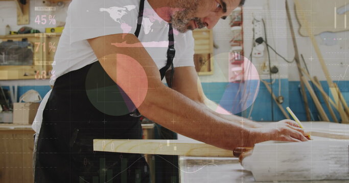 Image of world map and data processing over caucasian male carpenter working in workshop