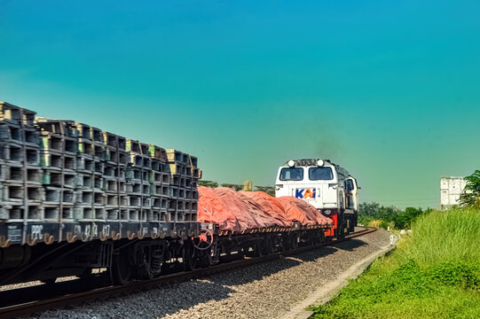 a series of goods trains pulled by a CC206 locomotive made by General Electric belonging to PT Kereta Api Indonesia, Indonesia, 28 October 2023.
