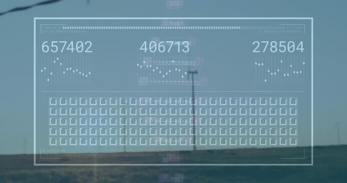 Overlay being animated with numeric readouts and scatter plots on grid while wind turbines rotating