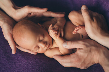 A newborn baby is wrapped in diapers with a wool cap in a basket. Swaddling, maternity hospital, family, ivf, life planning, parenting. A mother's love for her child. Baby food. High quality photo