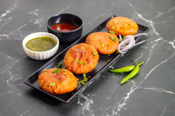Onion kachori is a crispy, deep-fried Indian snack filled with spiced onion mixture, popular in Rajasthan, especially during tea time.
