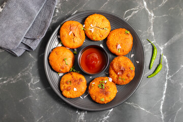 Onion kachori is a crispy, deep-fried Indian snack filled with spiced onion mixture, popular in Rajasthan, especially during tea time.
