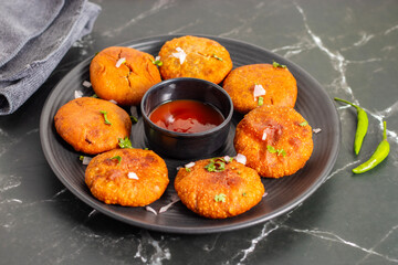 Onion kachori is a crispy, deep-fried Indian snack filled with spiced onion mixture, popular in Rajasthan, especially during tea time.

