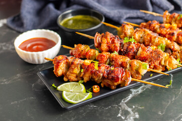 Chicken satay is grilled, marinated chicken skewers served with a rich, savory peanut sauce, popular in Southeast Asian cuisine.
