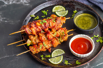 Chicken satay is grilled, marinated chicken skewers served with a rich, savory peanut sauce, popular in Southeast Asian cuisine.
