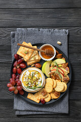 Baked Camembert with honey, pistachios, top view