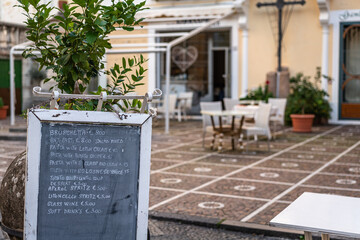 italian restaurant outdoor patio with menu sign