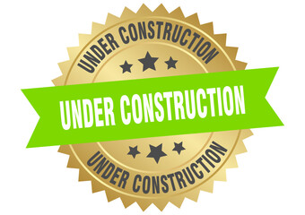 under construction. under construction round green and gold label isolated on transparent background