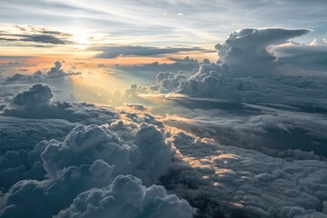 Fototapeta premium Overhead view of a massive cloud deck illuminated by low sunlight during dusk