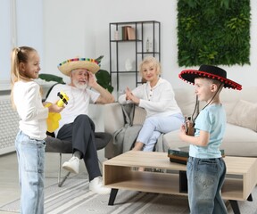 Grandparents and their grandkids having fun together at home