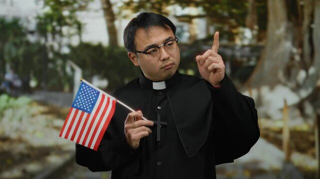 Young man dressed as priest holding american flag in a park setting, blending religious symbolism with national identity in an outdoor environment.