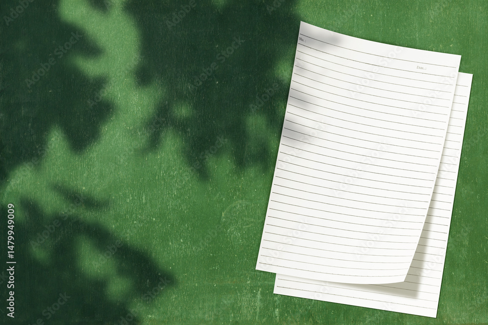 Poster top view stack of business letterhead with shadow on a green background. blank paper or sheet. mocku