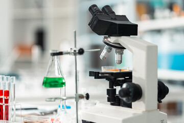 Modern scientific laboratory interior with advanced equipment and microscope setup for medical research, chemical testing, and biotechnology innovation in a professional healthcare environment