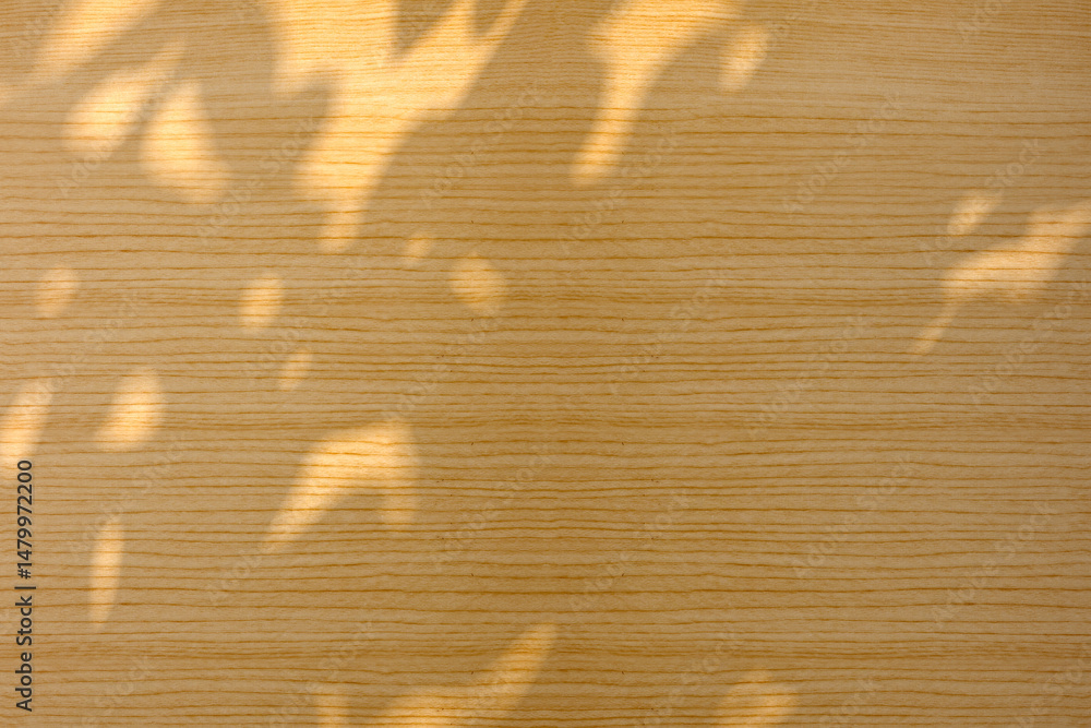 Poster top view of a shadow on a wooden background. copy space. texture background