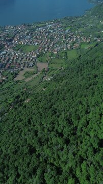 A stunning aerial view from Balota del Coren, capturing the calm waters of Lake Iseo and the majestic Monte Isola. This peaceful drone shot showcases the natural beauty of northern Italy.