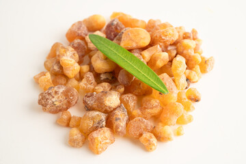 Frankincense or olibanum aromatic resin isolated on white background used in incense and perfumes.