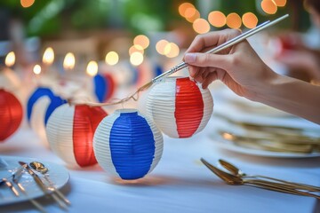 Painting Patriotic Paper Lanterns for Celebration on Table with Golden Cutlery and Soft Bokeh Lights