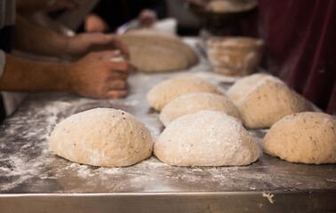 Yeast dough in the form of loaves waiting to be cooked