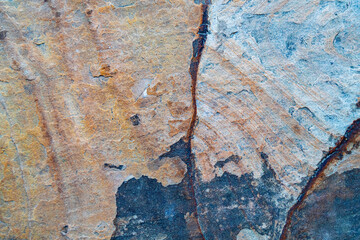 Natural stone texture with earthy brown and orange tones. Rough mineral surface ideal for...