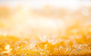 Close up bright orange Oil or beer splash texture and nature waves, Beautiful waves curve and...