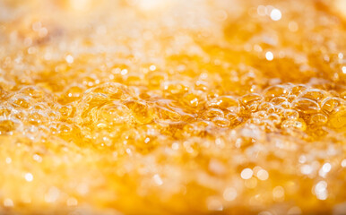 Close up bright orange Oil or beer splash texture and nature waves, Beautiful waves curve and...