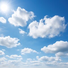 Fototapeta premium Wide open sky with a few scattered clouds illuminated by sunlight, providing an expansive and uplifting backdrop