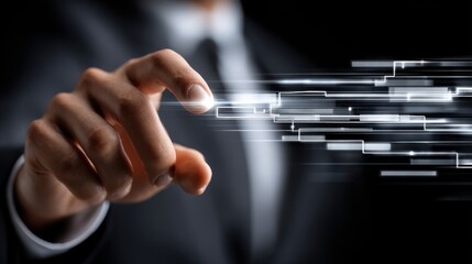 A man in a suit is pointing at a screen with a bright light