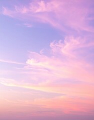 Obraz premium A breathtaking pink sky at dusk, adorned with fluffy white clouds, casting a warm glow over the horizon, creating a serene and dreamy atmosphere.