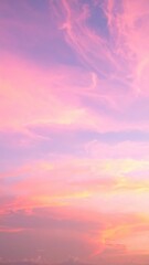 Obraz premium A serene pink sky at dusk, adorned with fluffy white clouds gently illuminated by the fading sunlight, creating a tranquil and dreamy atmosphere.