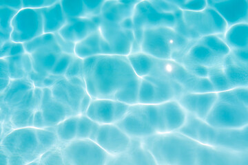 Blue swimming pool water surface and ripple wave background. Summer abstract.