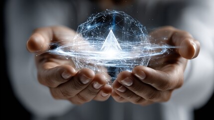 A person is holding a sphere in their hands, which is surrounded by a blue
